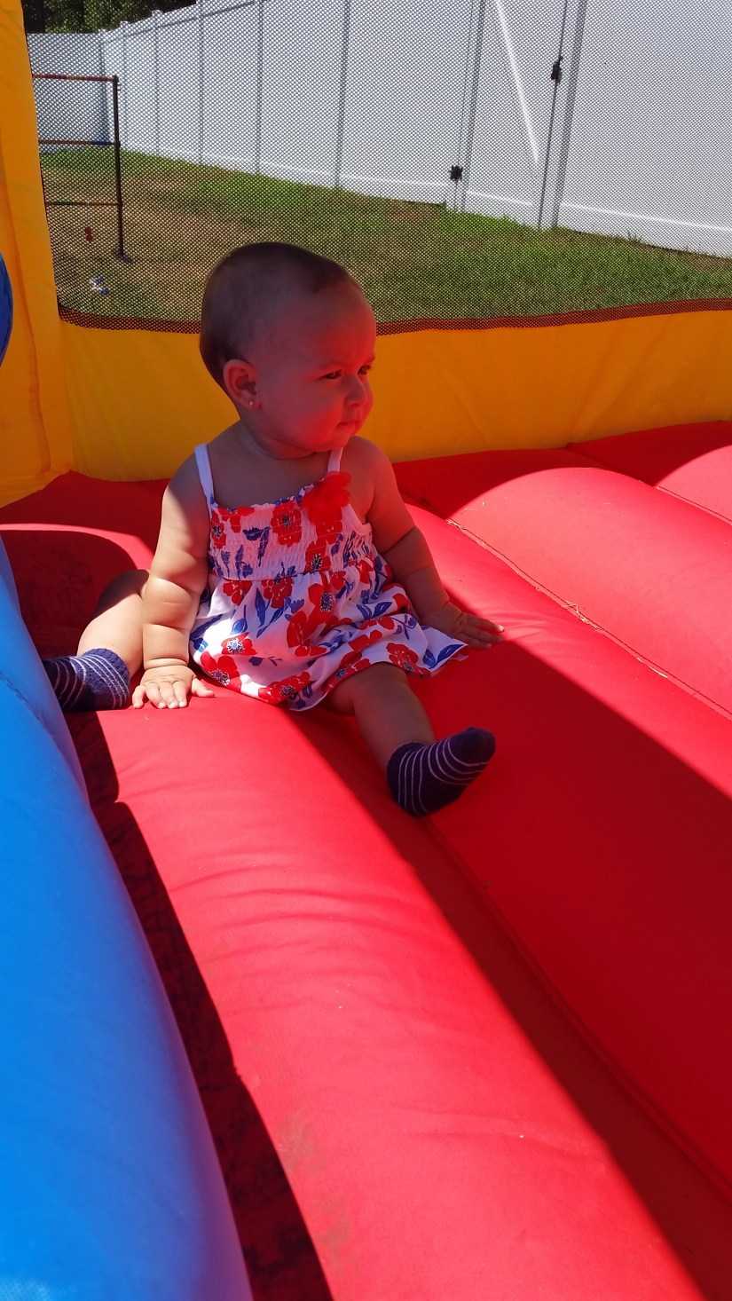 Elleanna in the bounce house.